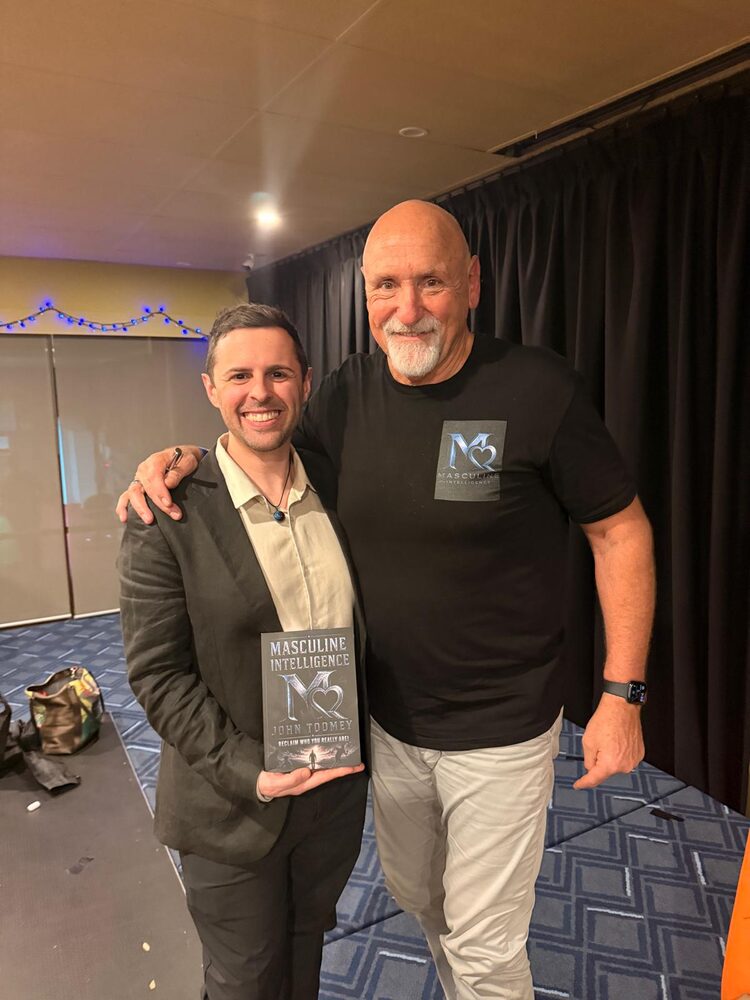 John Toomey with a reader holding Masculine Intelligence